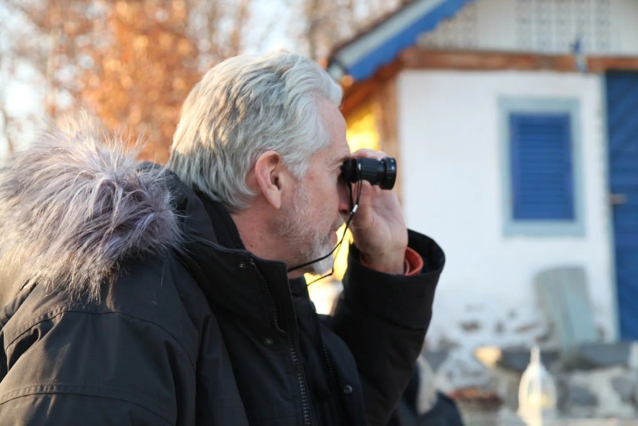 Photographer Outdoors with Telescope