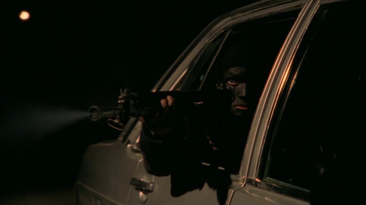 Night-time car interior scene with a driver’s face visible through the window and a tense, noir-lit atmosphere.